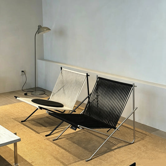 Minimalist woven folding lounge chair, curated unique designer furniture for balcony living room home decor

