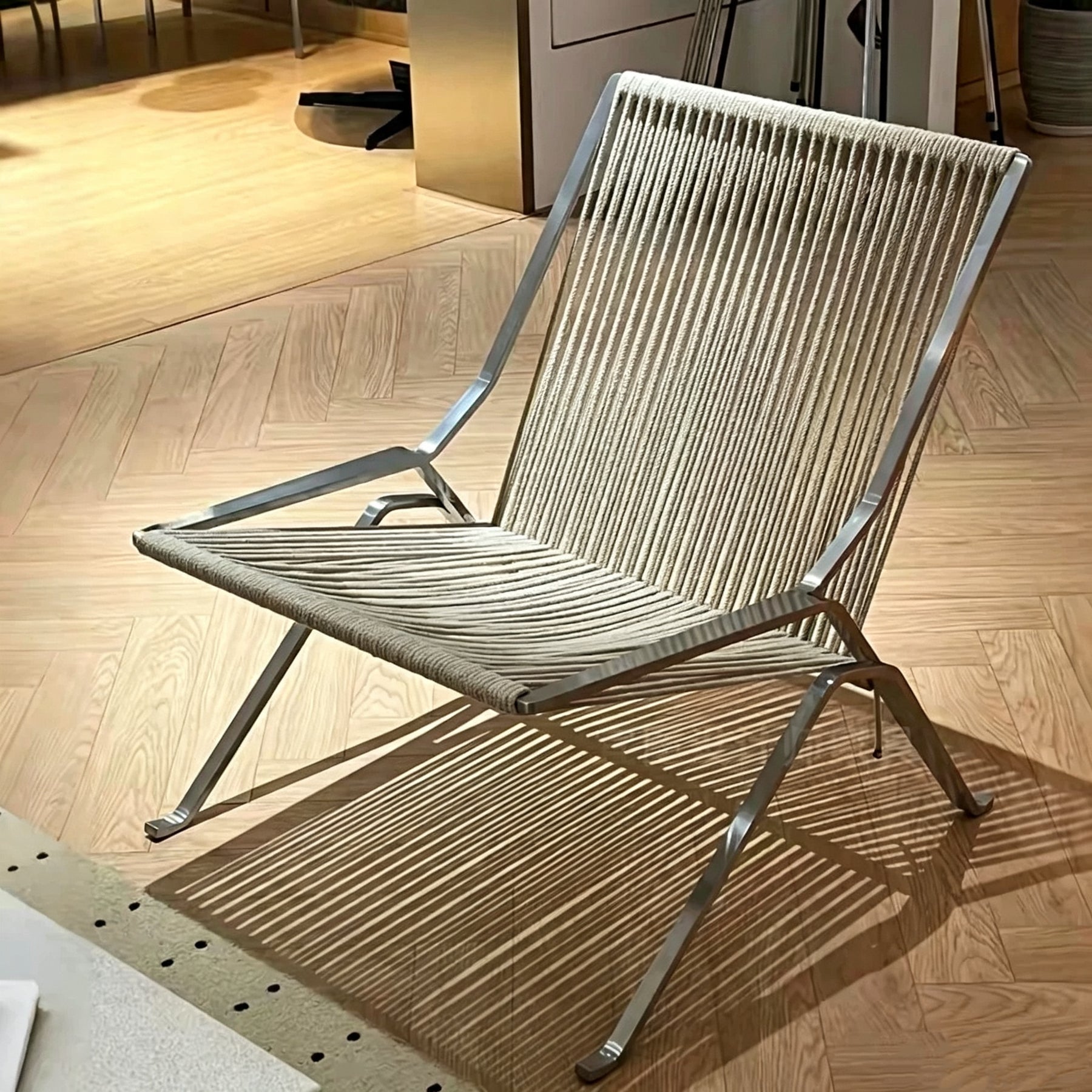 Minimalist Designer Lounge Chair, Hand‑Woven Olefin Rope Surface, Polished Stainless Steel Frame, Home Accent Furniture