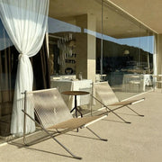 Minimalist woven folding lounge chair, curated unique designer furniture for balcony living room home decor