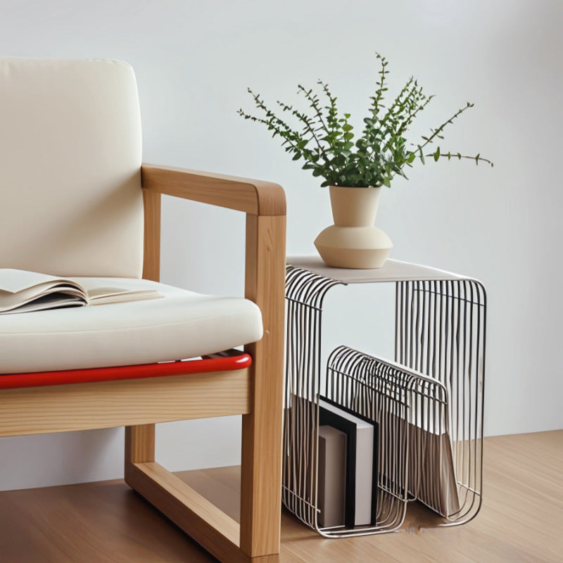 304 stainless steel wire-grid side table with open shelves and built-in magazine rack, styled with books and cups