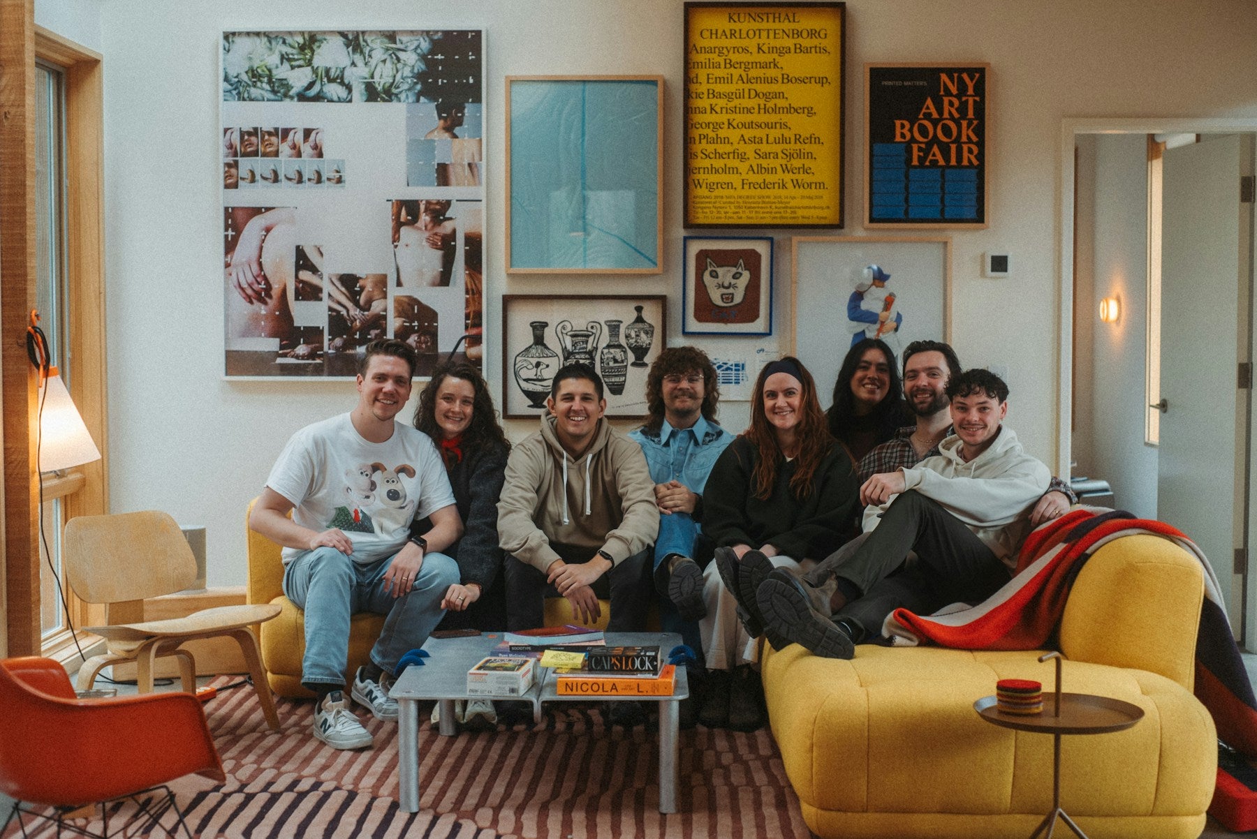 People sharing a relaxed moment in a furnished room